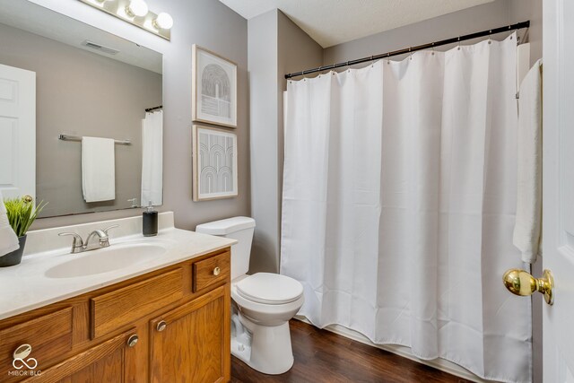 2289 Salem Park Dr, Indianapolis, IN 46239 - bathroom with vanity, wood finished floors, and a shower with shower curtain