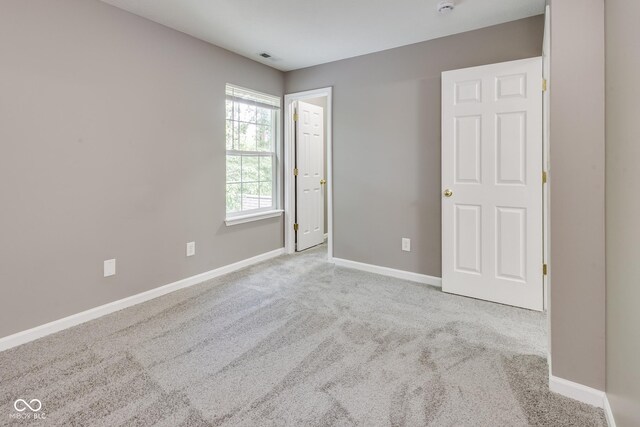 2289 Salem Park Dr, Indianapolis, IN 46239 - unfurnished bedroom with carpet floors and baseboards