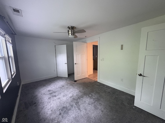 917 N Rural St, Indianapolis, IN 46201 - unfurnished bedroom with carpet and a ceiling fan