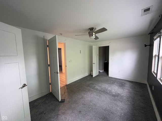 917 N Rural St, Indianapolis, IN 46201 - unfurnished bedroom with ceiling fan and carpet flooring
