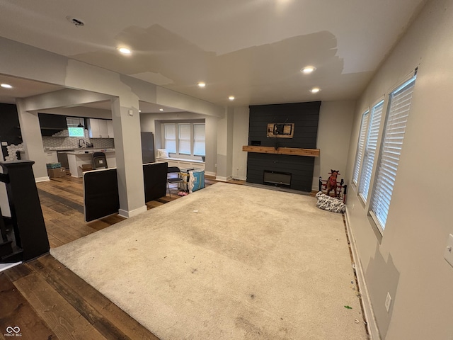 917 N Rural St, Indianapolis, IN 46201 - living room with a fireplace, dark wood-style floors, and recessed lighting