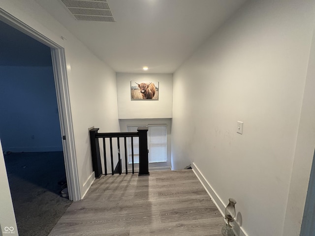 917 N Rural St, Indianapolis, IN 46201 - stairs with wood finished floors and recessed lighting