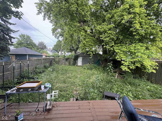 917 N Rural St, Indianapolis, IN 46201 - fenced backyard with a wooden deck and a storage shed