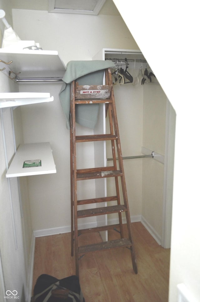 3115 E 400 S, Anderson, IN 46017 - walk in closet featuring wood finished floors and attic access