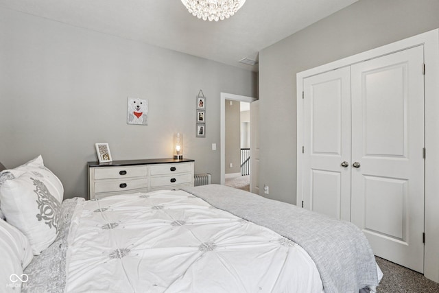 2105 Granville Dr, Westfield, IN 46074 - bedroom featuring carpet, a closet, a chandelier, and radiator heating unit