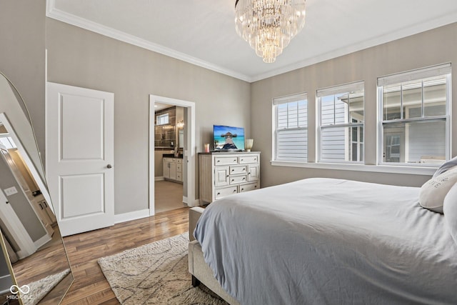 2105 Granville Dr, Westfield, IN 46074 - bedroom featuring crown molding, wood finished floors, a chandelier, and ensuite bathroom