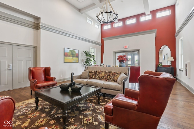2105 Granville Dr, Westfield, IN 46074 - living room with a towering ceiling, a chandelier, beam ceiling, hardwood / wood-style floors, and coffered ceiling