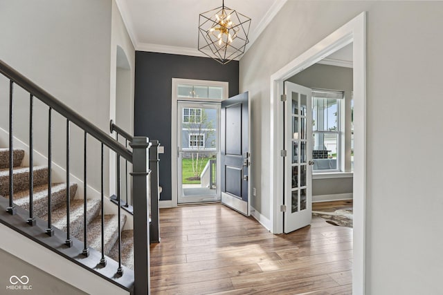 2105 Granville Dr, Westfield, IN 46074 - foyer entrance featuring ornamental molding, hardwood / wood-style floors, stairs, and a chandelier