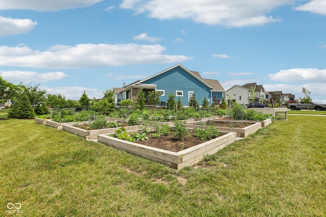2105 Granville Dr, Westfield, IN 46074 - rear view of property with a garden and a lawn