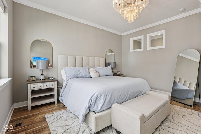 2105 Granville Dr, Westfield, IN 46074 - bedroom featuring ornamental molding, wood finished floors, and a chandelier