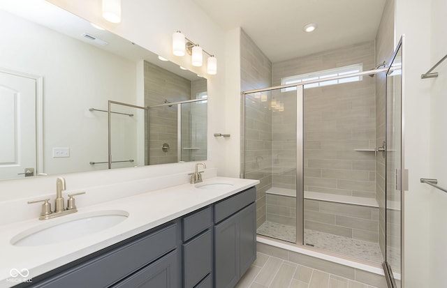 14521 Hanford Ln, Carmel, IN 46074 - full bathroom with double vanity, a stall shower, tile patterned floors, and recessed lighting