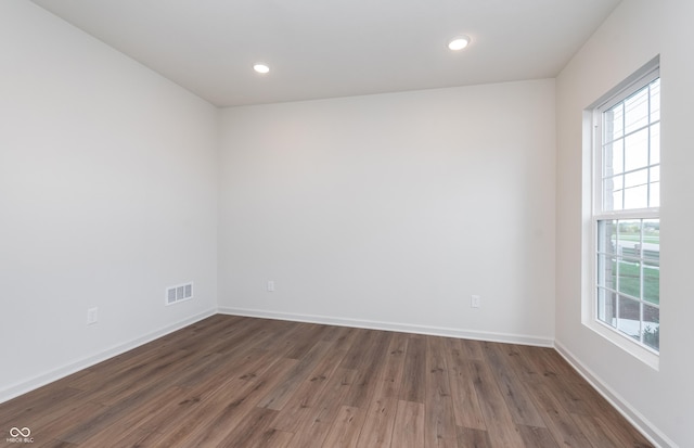14521 Hanford Ln, Carmel, IN 46074 - unfurnished room with healthy amount of natural light, wood finished floors, and recessed lighting