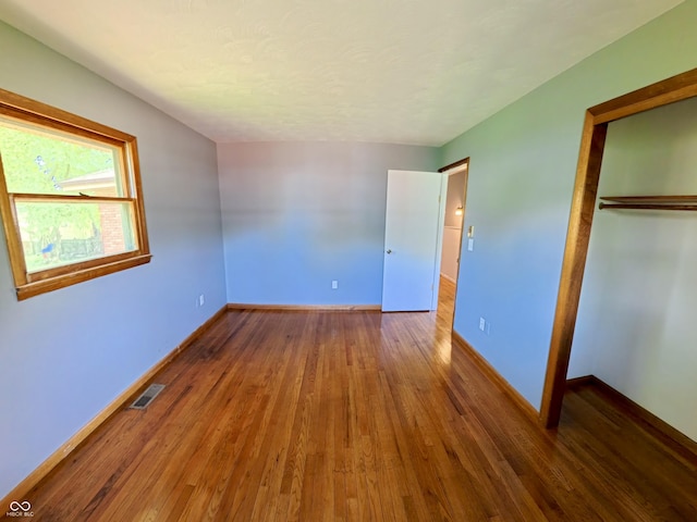 771 Doran Ave, Shelbyville, IN 46176 - unfurnished bedroom featuring a closet and wood finished floors