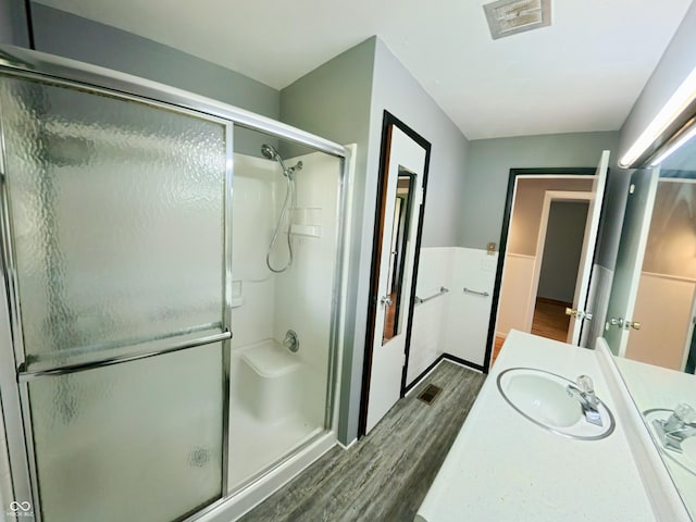 771 Doran Ave, Shelbyville, IN 46176 - bathroom with wood finished floors, a shower stall, and vanity