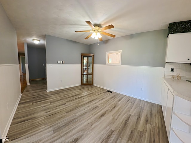 771 Doran Ave, Shelbyville, IN 46176 - spare room with a ceiling fan, light wood-type flooring, and a wainscoted wall