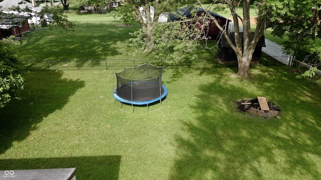 771 Doran Ave, Shelbyville, IN 46176 - fenced backyard featuring a trampoline