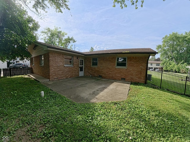 771 Doran Ave, Shelbyville, IN 46176 - back of house featuring a patio, brick siding, and crawl space