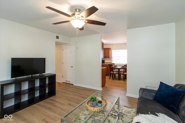 717 Berkeley Dr, Shelbyville, IN 46176 - living room with a ceiling fan and light wood finished floors