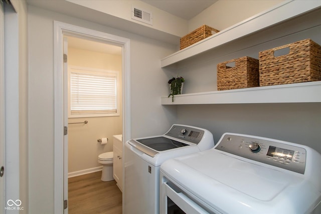 717 Berkeley Dr, Shelbyville, IN 46176 - laundry area featuring independent washer and dryer and light wood-type flooring