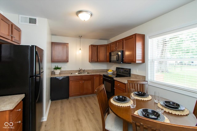 717 Berkeley Dr, Shelbyville, IN 46176 - kitchen with black appliances and brown cabinets