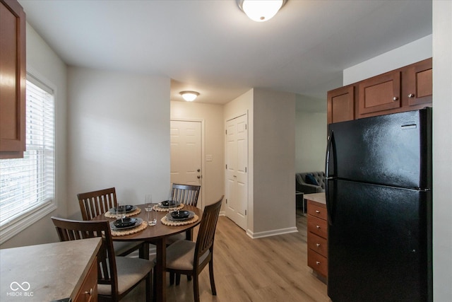717 Berkeley Dr, Shelbyville, IN 46176 - dining room with light wood-style floors and baseboards