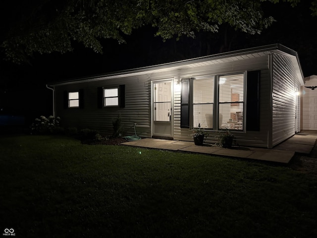 717 Berkeley Dr, Shelbyville, IN 46176 - view of front of home with a garage and a yard