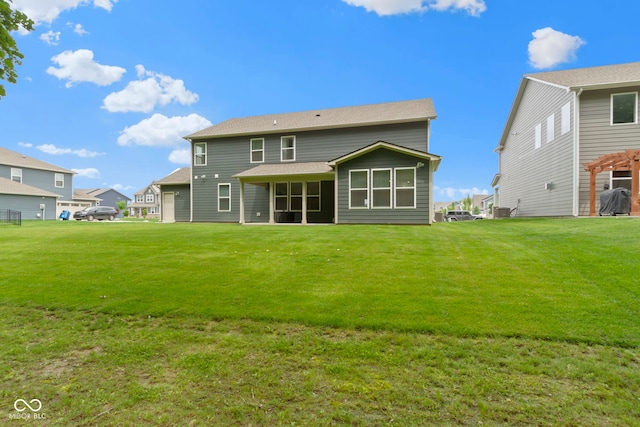 15546 Senita Ln, Fishers, IN 46037 - back of property featuring a lawn, a sunroom, and a residential view