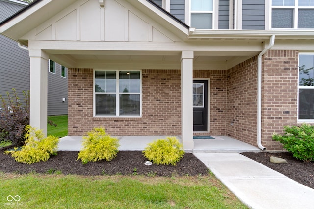 15546 Senita Ln, Fishers, IN 46037 - view of exterior entry with brick siding and board and batten siding