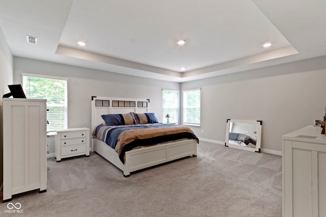 15546 Senita Ln, Fishers, IN 46037 - bedroom with a tray ceiling, light carpet, and recessed lighting