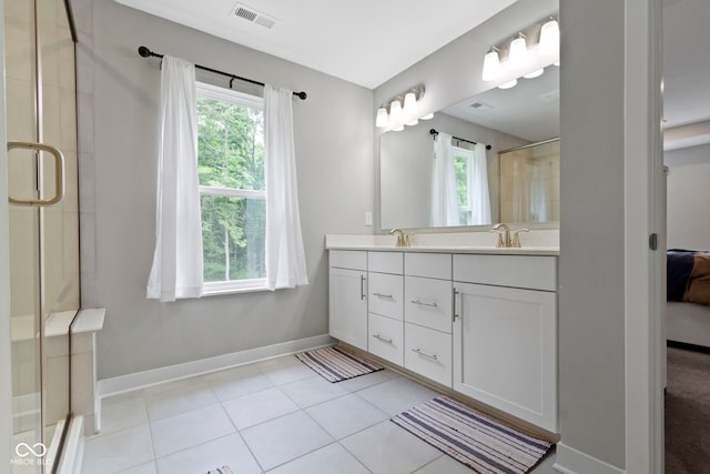 15546 Senita Ln, Fishers, IN 46037 - bathroom featuring double vanity, an enclosed shower, tile patterned floors, and connected bathroom
