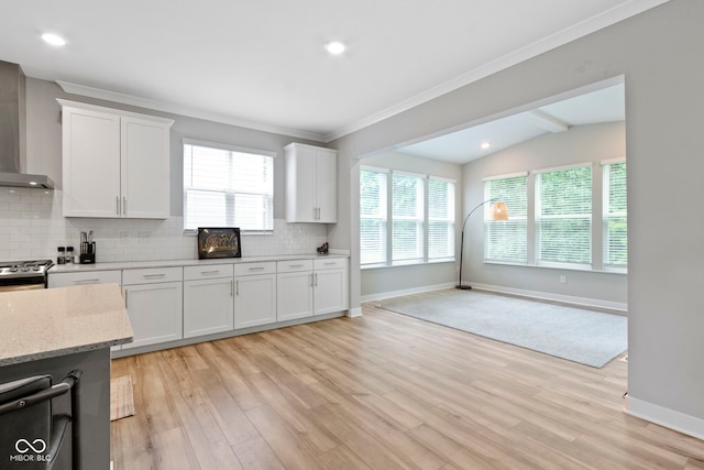 15546 Senita Ln, Fishers, IN 46037 - kitchen with tasteful backsplash, wall chimney exhaust hood, light wood-style flooring, vaulted ceiling, and recessed lighting