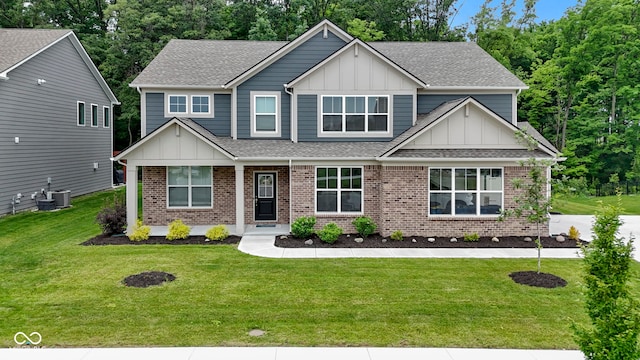 15546 Senita Ln, Fishers, IN 46037 - craftsman inspired home with board and batten siding, brick siding, a shingled roof, and a front yard