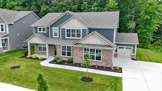 15546 Senita Ln, Fishers, IN 46037 - craftsman-style house featuring board and batten siding, concrete driveway, brick siding, a garage, and roof with shingles