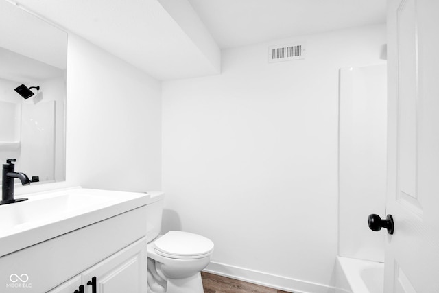 1555 N Dearborn St, Indianapolis, IN 46201 - bathroom with vanity, wood finished floors, and  shower combination