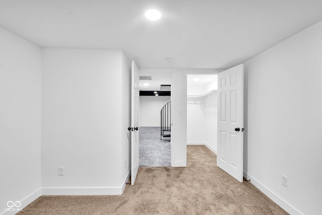 1555 N Dearborn St, Indianapolis, IN 46201 - unfurnished bedroom featuring carpet and recessed lighting