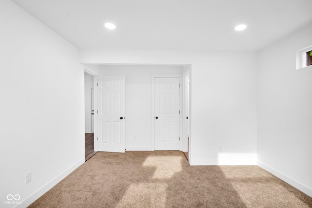 1555 N Dearborn St, Indianapolis, IN 46201 - unfurnished bedroom featuring carpet floors and recessed lighting