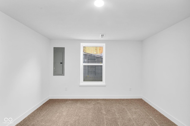 1555 N Dearborn St, Indianapolis, IN 46201 - carpeted empty room featuring electric panel and baseboards