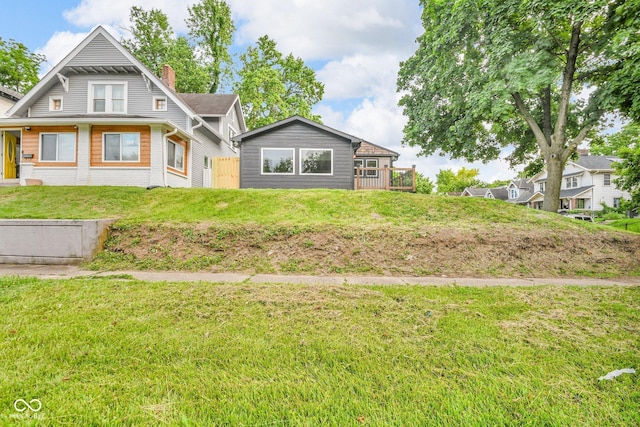 1555 N Dearborn St, Indianapolis, IN 46201 - view of front facade with a chimney and brick siding