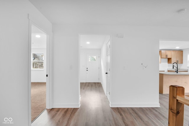 1555 N Dearborn St, Indianapolis, IN 46201 - hallway with light wood finished floors, plenty of natural light, and recessed lighting