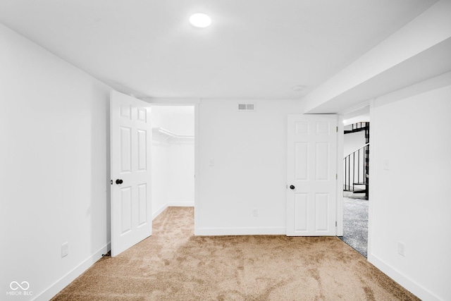 1555 N Dearborn St, Indianapolis, IN 46201 - unfurnished bedroom featuring carpet and a spacious closet
