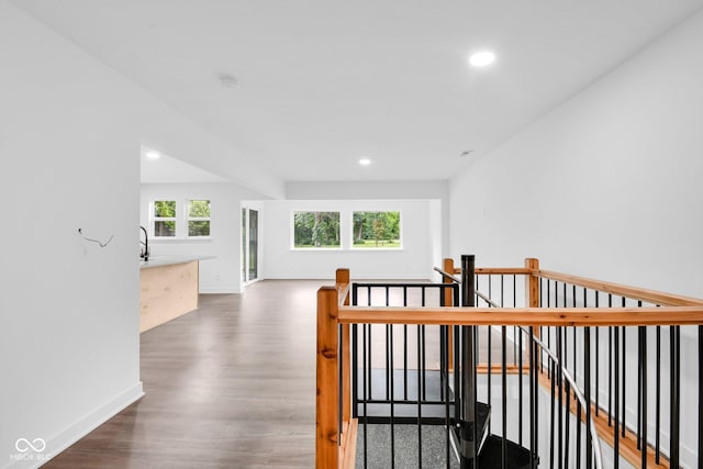 1555 N Dearborn St, Indianapolis, IN 46201 - hallway with an upstairs landing, wood finished floors, and recessed lighting