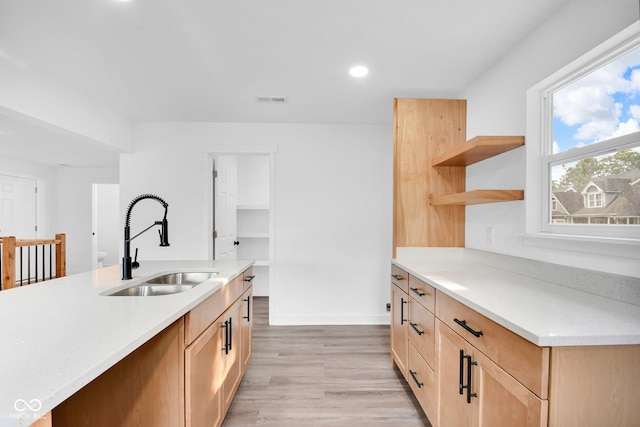 1555 N Dearborn St, Indianapolis, IN 46201 - kitchen featuring open shelves, light wood-style flooring, light countertops, recessed lighting, and light brown cabinetry