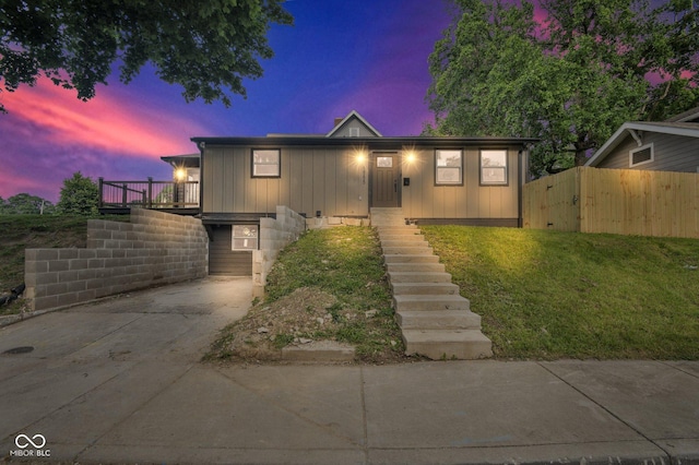 1555 N Dearborn St, Indianapolis, IN 46201 - view of front of house with stairway, concrete driveway, and board and batten siding