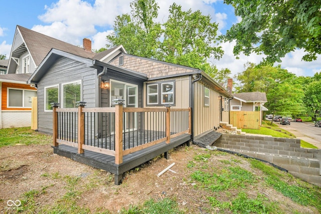1555 N Dearborn St, Indianapolis, IN 46201 - back of house with a deck and a chimney