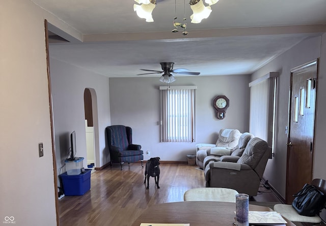 206 W 2nd St, Greensburg, IN 47240 - living room featuring arched walkways, ceiling fan, and wood finished floors