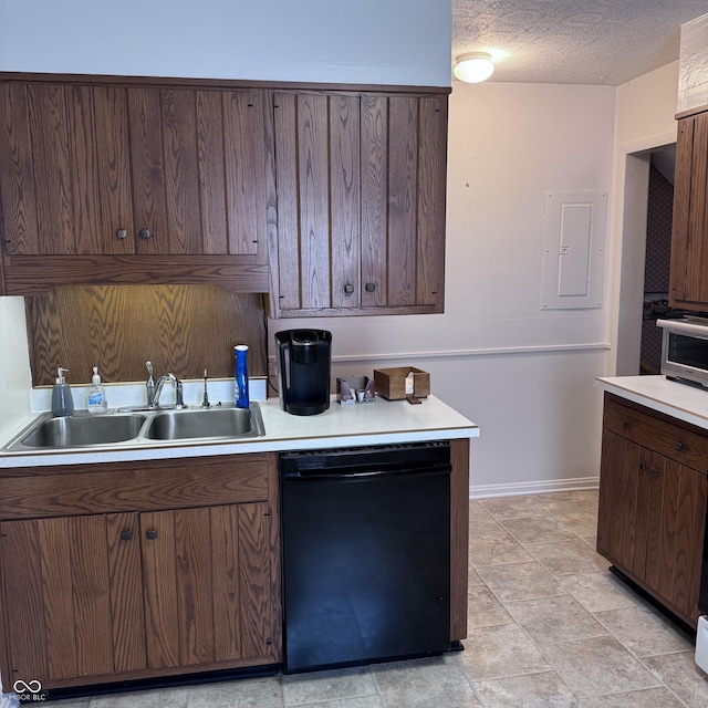 206 W 2nd St, Greensburg, IN 47240 - kitchen featuring black dishwasher, electric panel, light countertops, dark brown cabinetry, and a textured ceiling