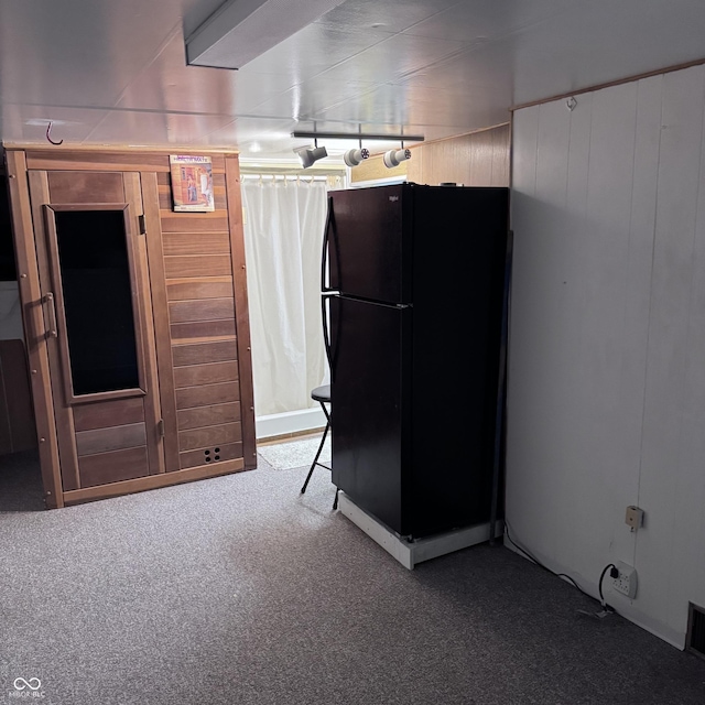 206 W 2nd St, Greensburg, IN 47240 - kitchen featuring freestanding refrigerator, carpet floors, and wood walls