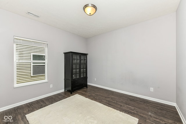 561 Farnham Dr, Westfield, IN 46074 - spare room featuring dark wood-type flooring and baseboards