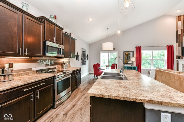 561 Farnham Dr, Westfield, IN 46074 - kitchen with stainless steel appliances, light wood-type flooring, healthy amount of natural light, dark brown cabinetry, and recessed lighting