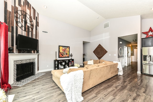 561 Farnham Dr, Westfield, IN 46074 - living area with wood finished floors, high vaulted ceiling, and a tile fireplace